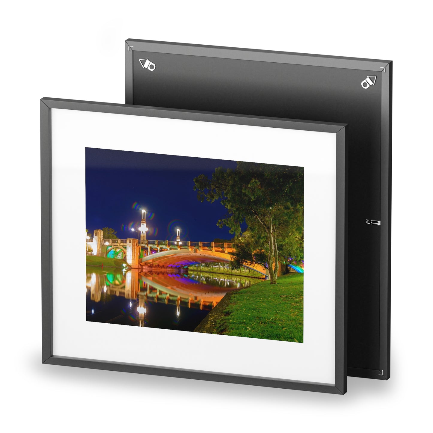 The stunning Victoria Bridge brightly lit at night printed on a framed matte poster