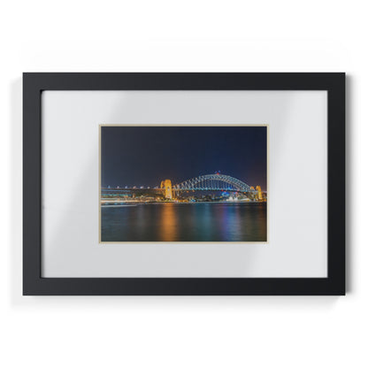 The dazzling Sydney Harbour Bridge at night printed on a black framed poster