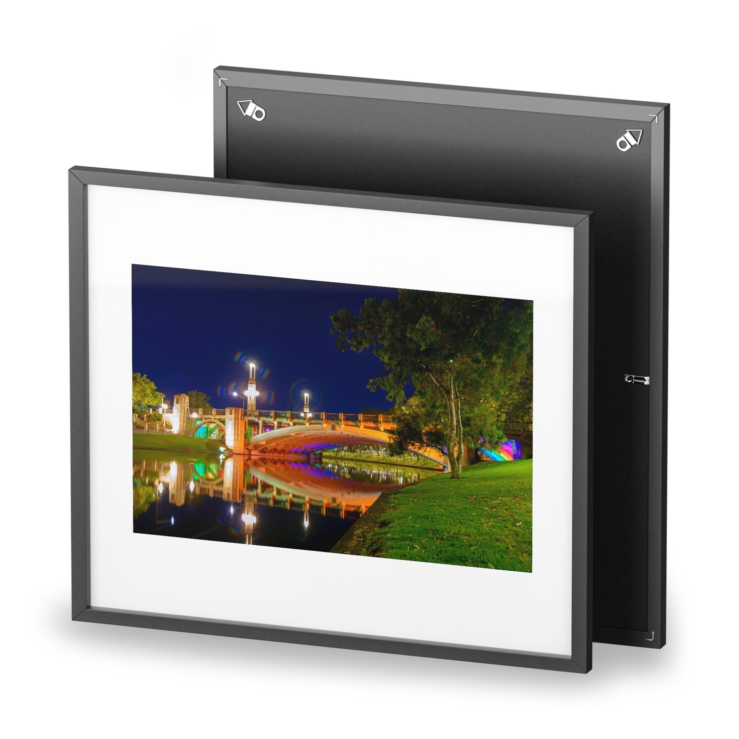 The stunning Victoria Bridge brightly lit at night printed on a framed matte poster