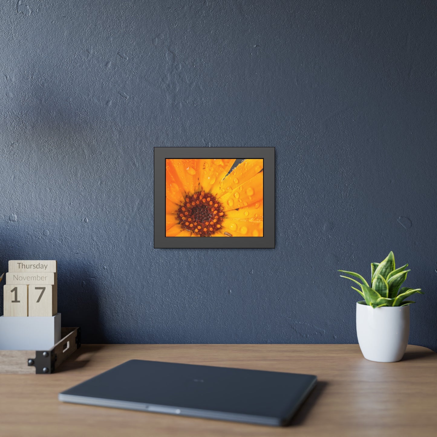 Drenched yellow flower printed on a framed paper poster