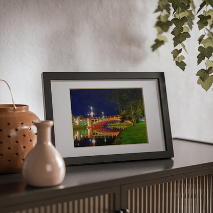 The stunning Victoria Bridge brightly lit at night printed on a black framed poster