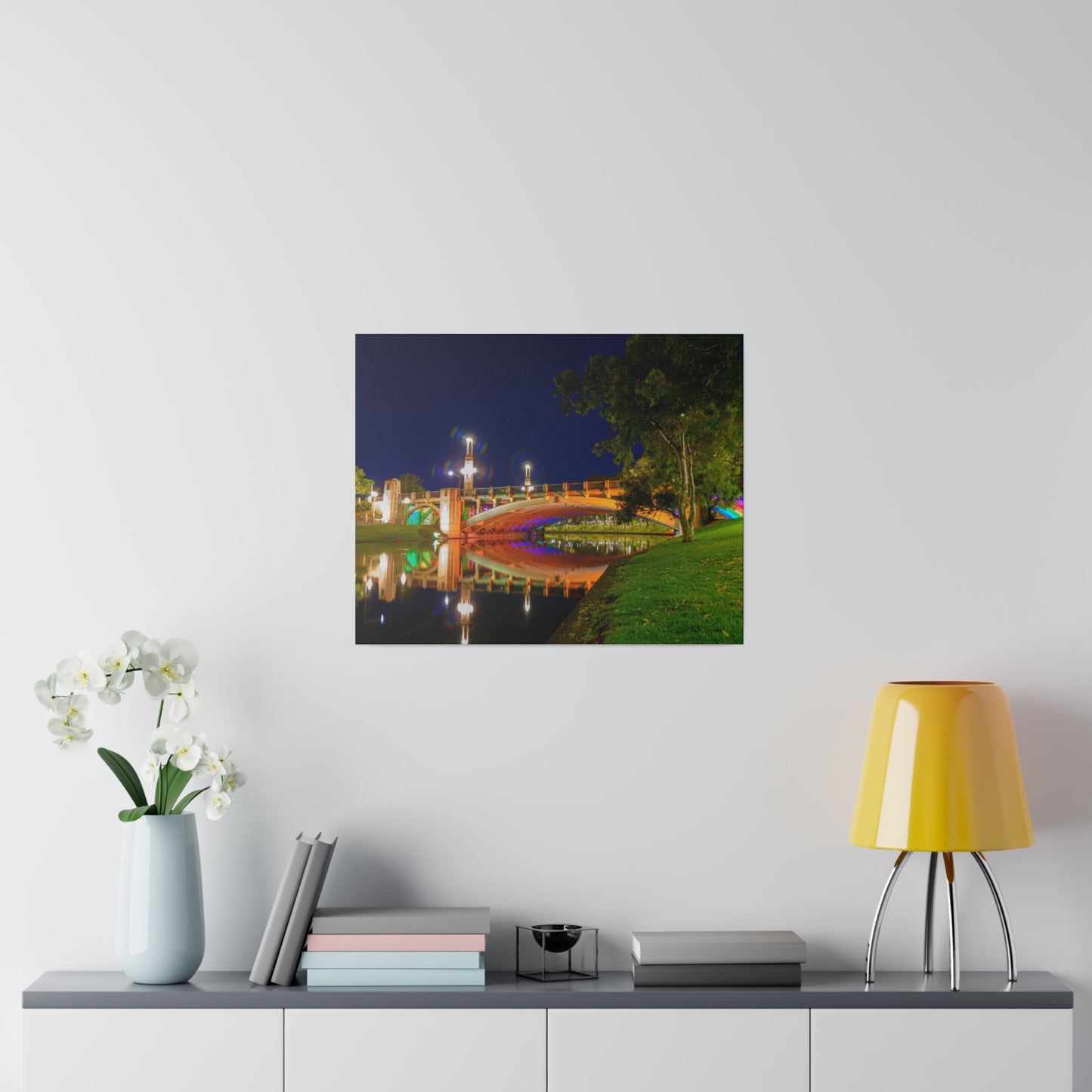 The stunning Victoria Bridge brightly lit at night printed on a stretched matte canvas