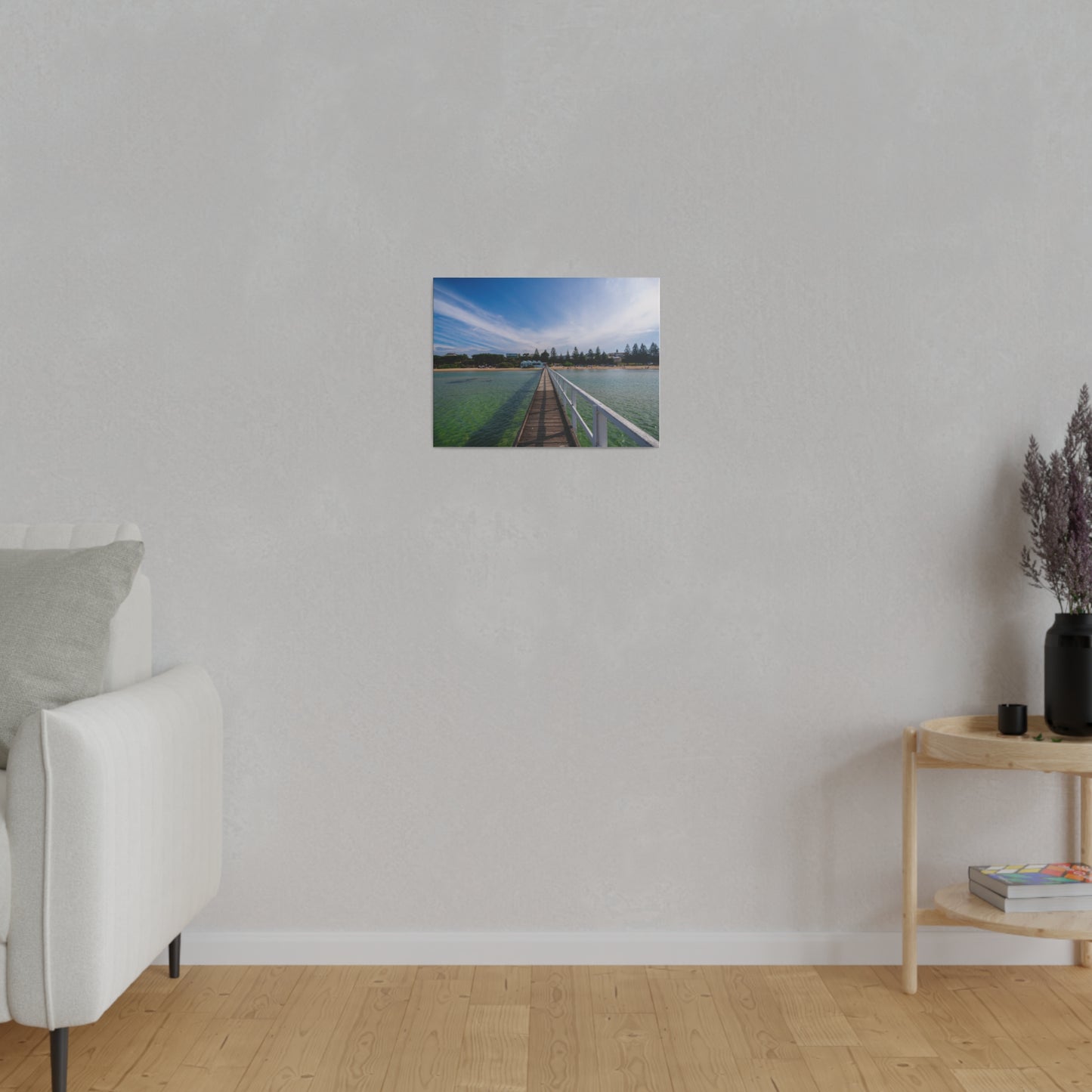 A beautiful jetty leading towards the shore over turquoise waters printed on a stretched matte canvas