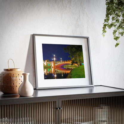 The stunning Victoria Bridge brightly lit at night printed on a framed matte poster