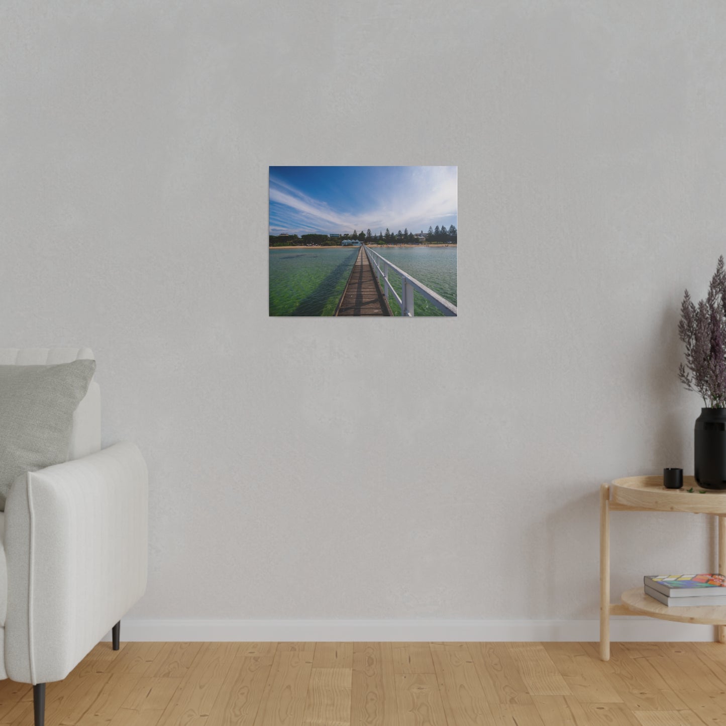 A beautiful jetty leading towards the shore over turquoise waters printed on a stretched matte canvas