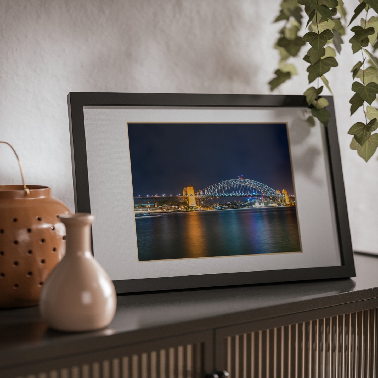 The dazzling Sydney Harbour Bridge at night printed on a black framed poster