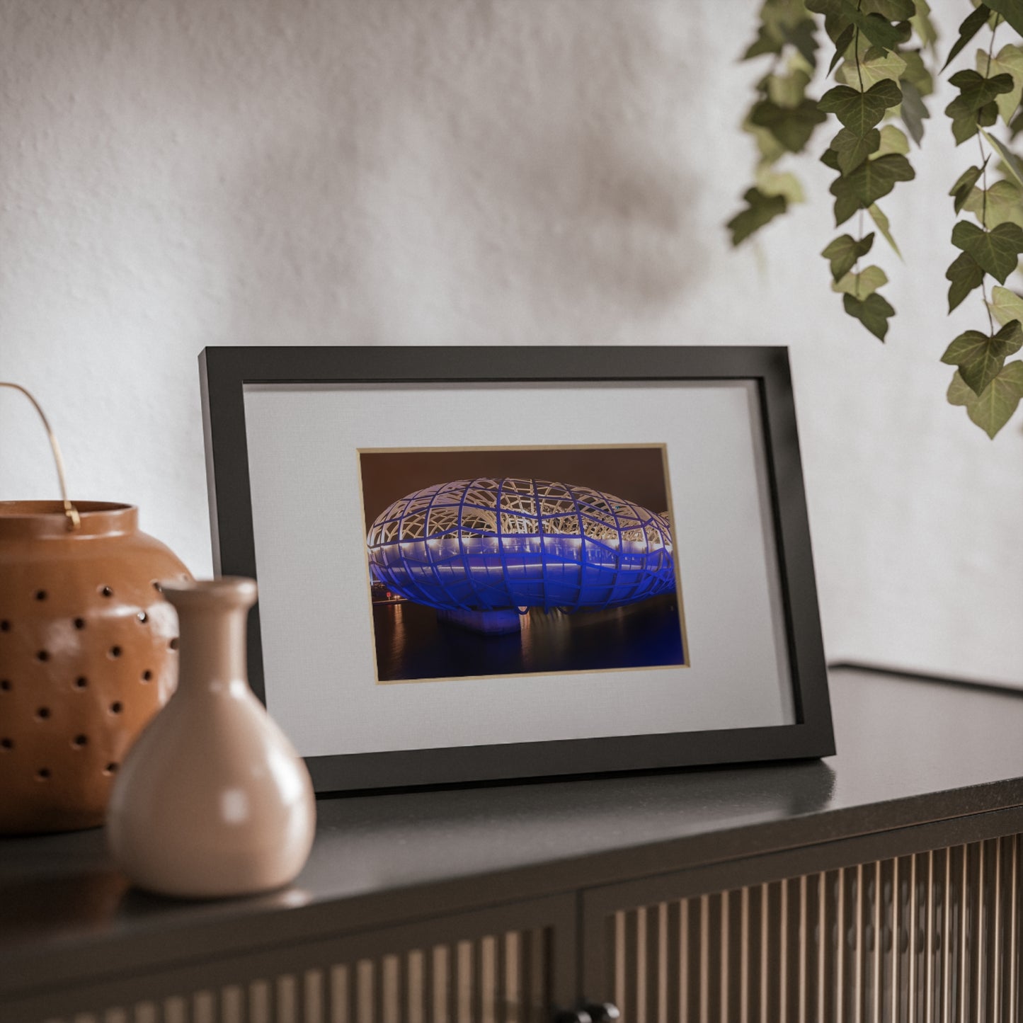 The beautiful Webb Bridge illuminated at night printed on a black framed poster