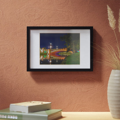 The stunning Victoria Bridge brightly lit at night printed on a black framed poster