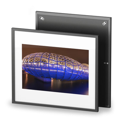 The beautiful Webb Bridge illuminated at night printed on a framed matte poster