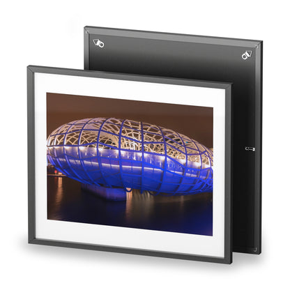 The beautiful Webb Bridge illuminated at night printed on a framed matte poster