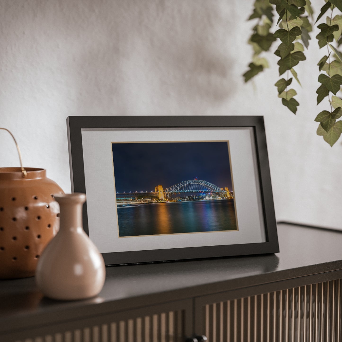 The dazzling Sydney Harbour Bridge at night printed on a black framed poster