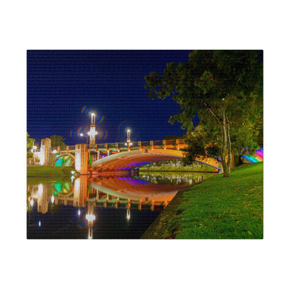 The stunning Victoria Bridge brightly lit at night printed on a stretched matte canvas