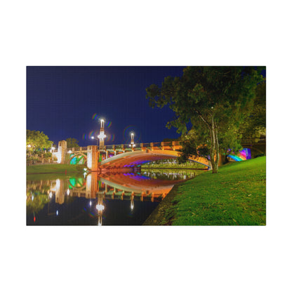 The stunning Victoria Bridge brightly lit at night printed on a stretched matte canvas