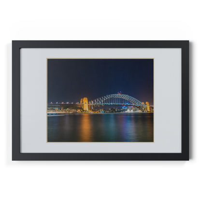 The dazzling Sydney Harbour Bridge at night printed on a black framed poster