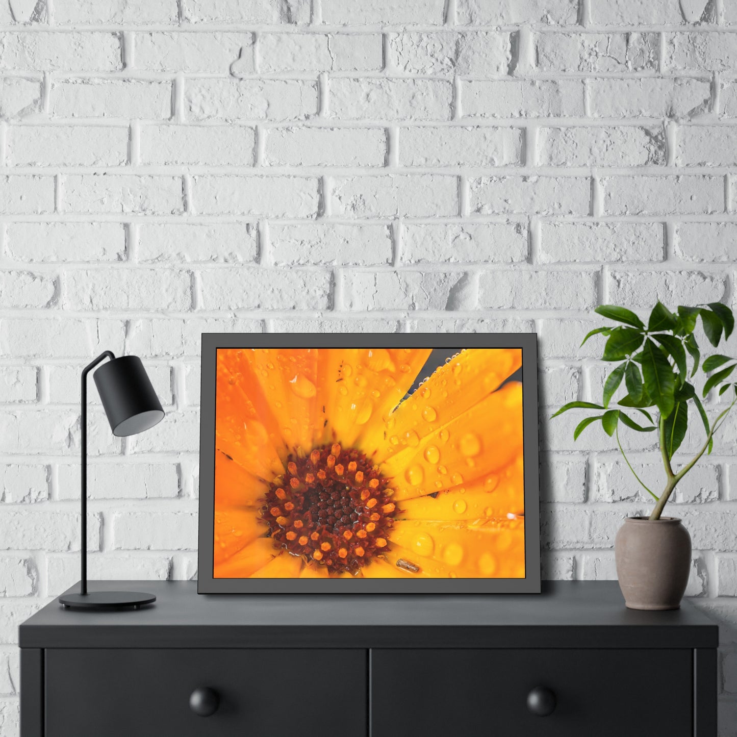 Drenched yellow flower printed on a framed paper poster