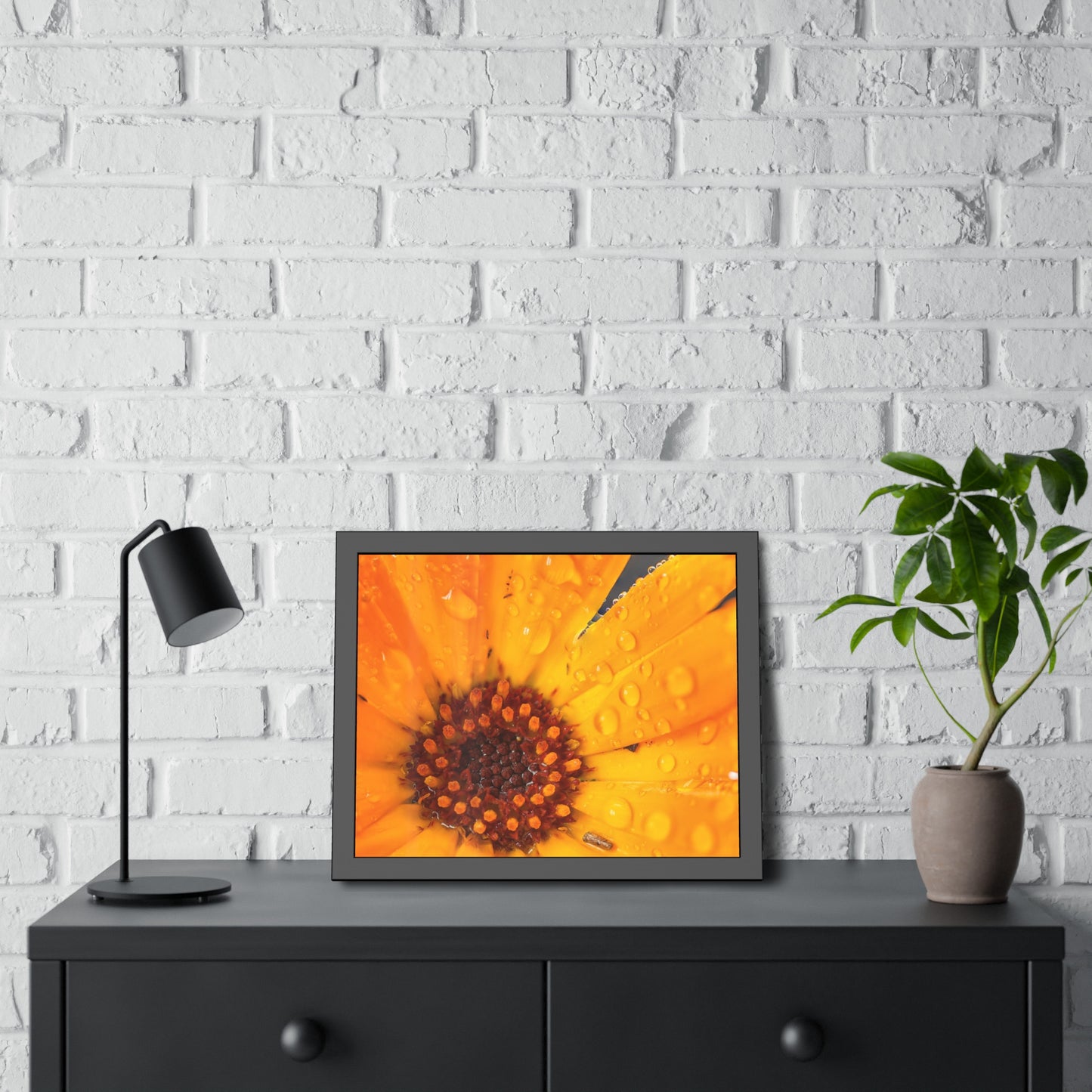 Drenched yellow flower printed on a framed paper poster