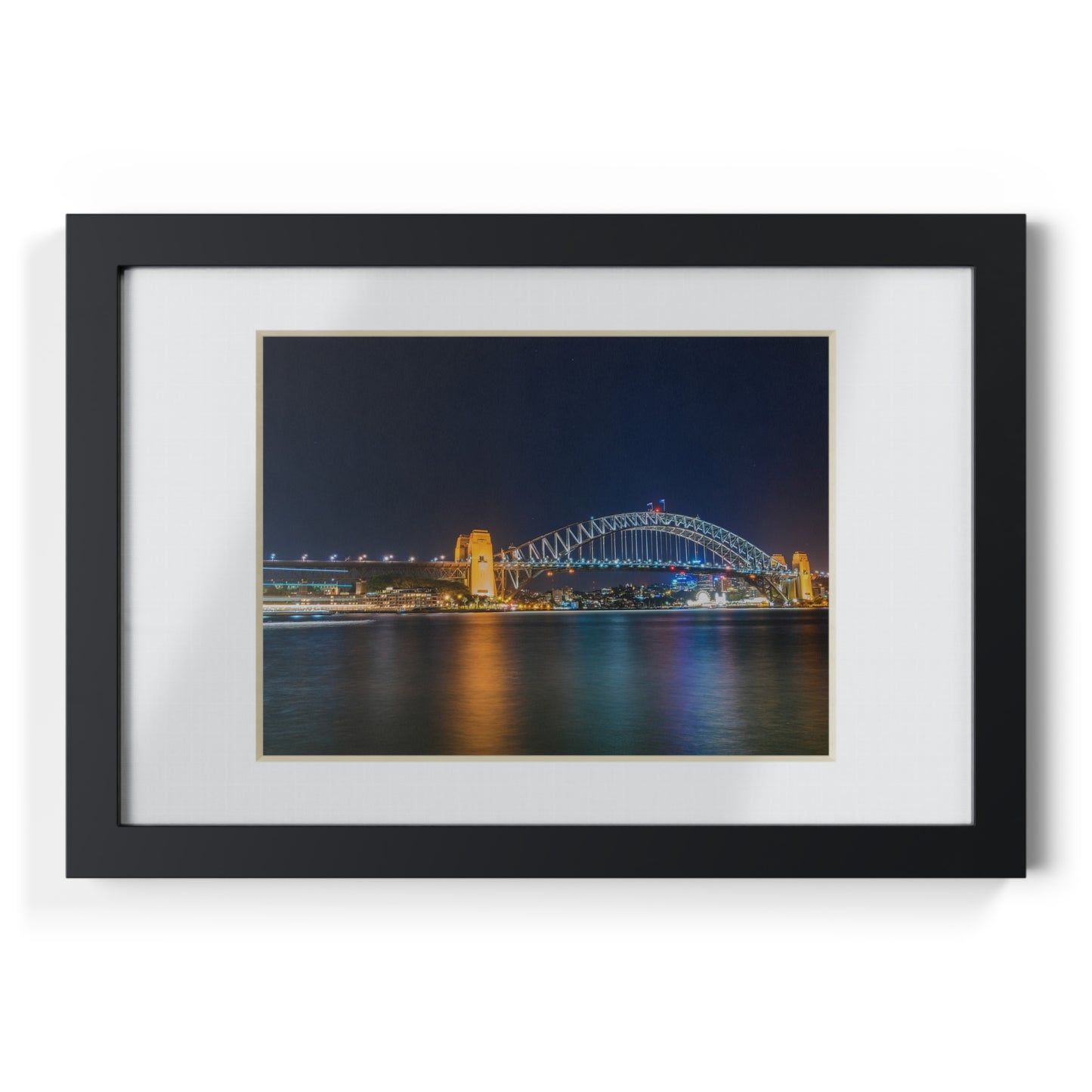 The dazzling Sydney Harbour Bridge at night printed on a black framed poster