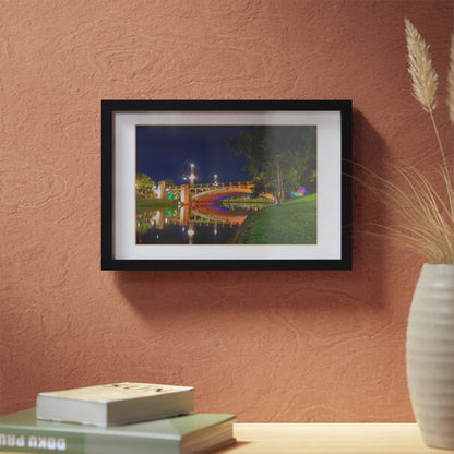 The stunning Victoria Bridge brightly lit at night printed on a black framed poster