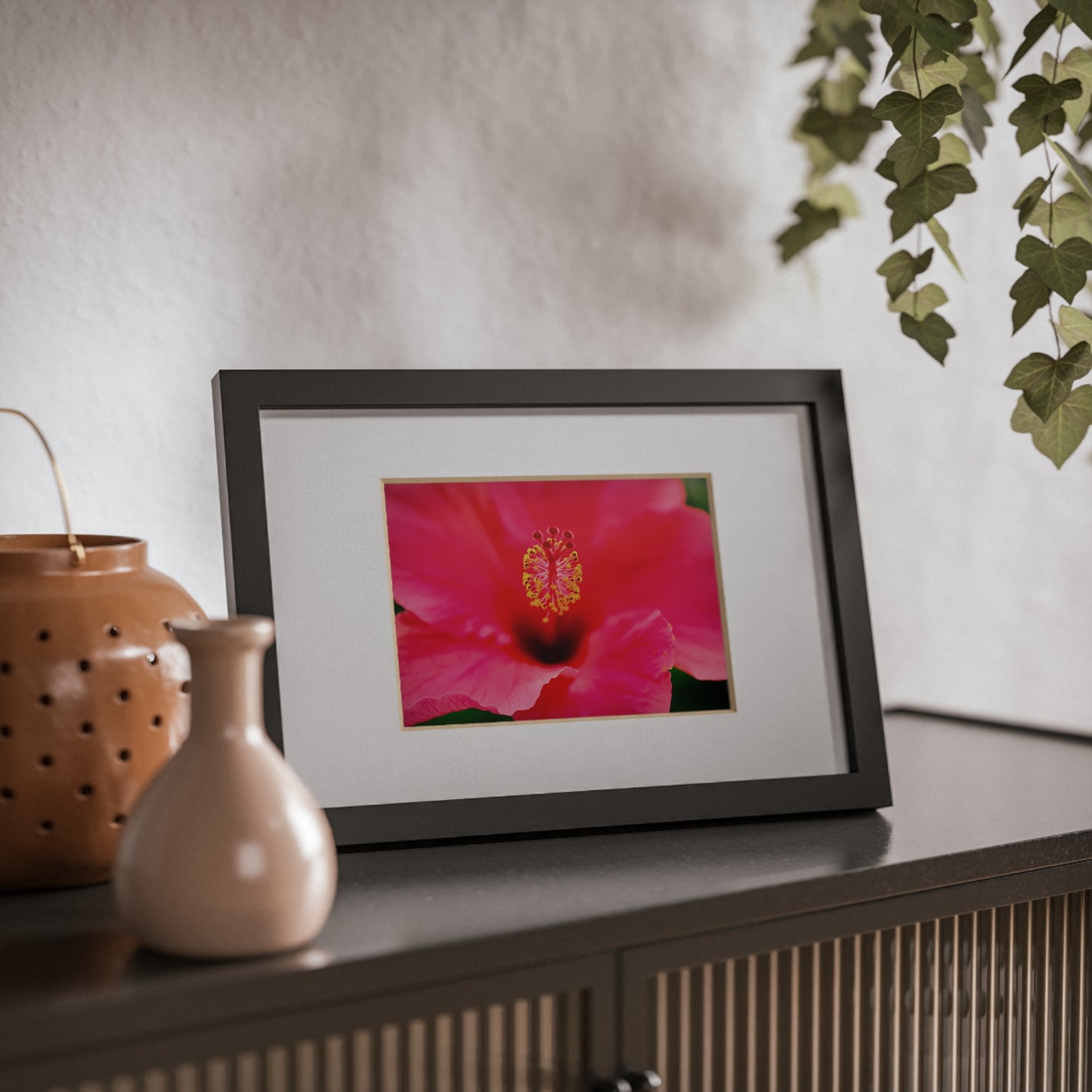 A beautiful hibiscus flower printed on a black framed poster