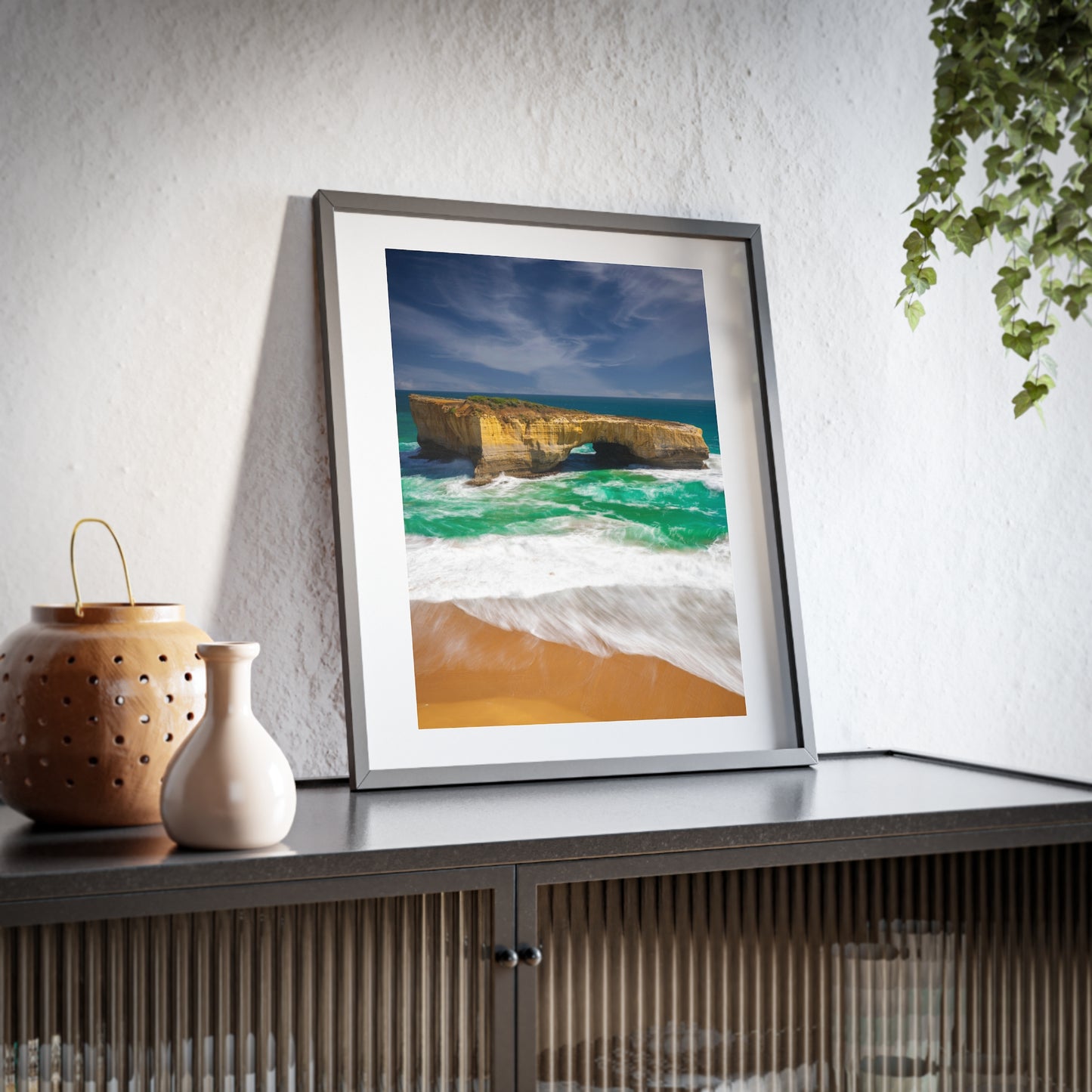 The London Bridge arch with crashing waves printed on a matte framed poster