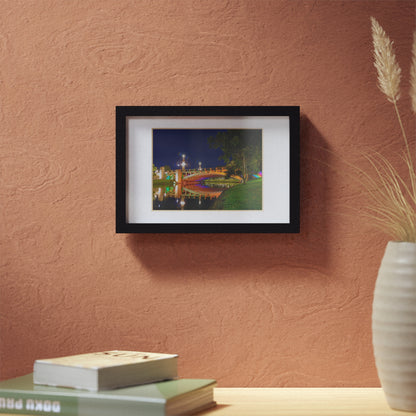 The stunning Victoria Bridge brightly lit at night printed on a black framed poster