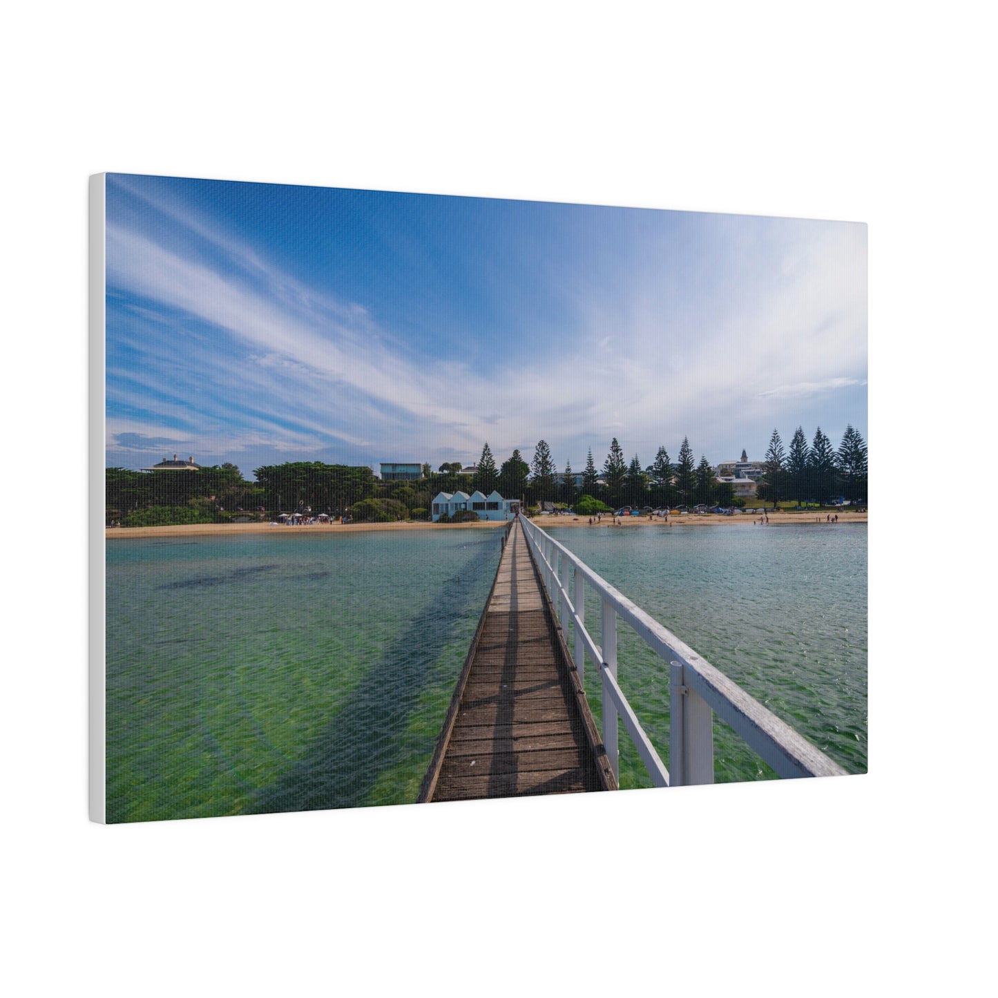 A beautiful jetty leading towards the shore over turquoise waters printed on a stretched matte canvas