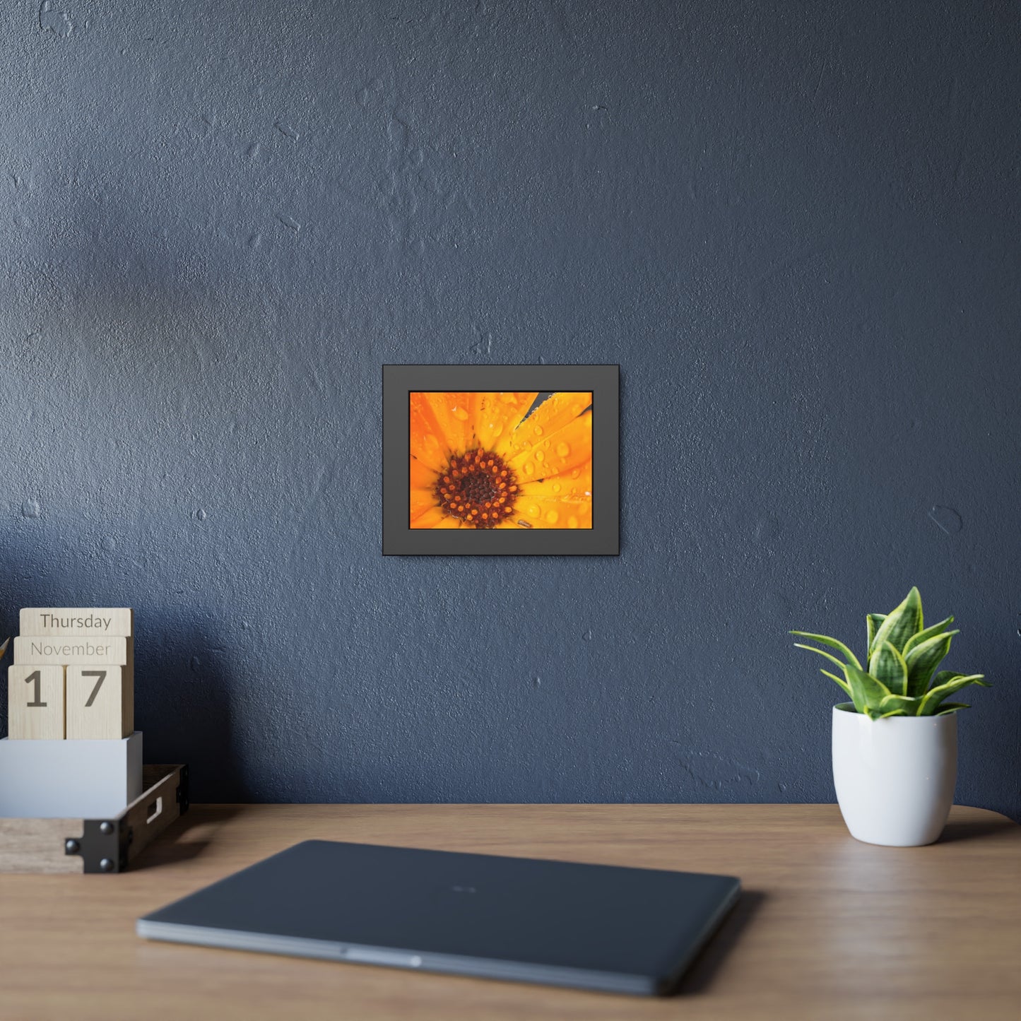 Drenched yellow flower printed on a framed paper poster