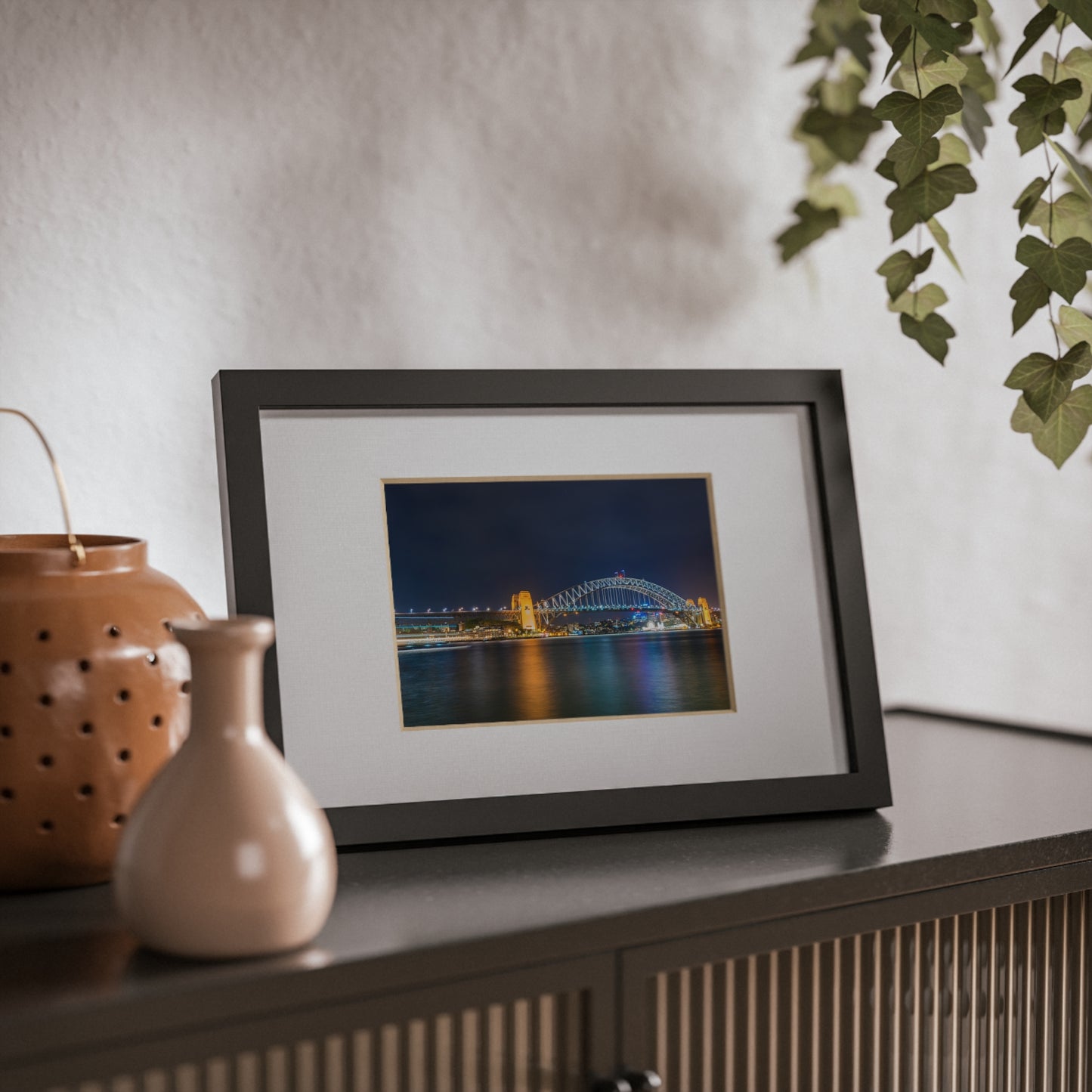 The dazzling Sydney Harbour Bridge at night printed on a black framed poster