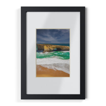 The London Bridge arch with crashing waves printed on a black framed poster