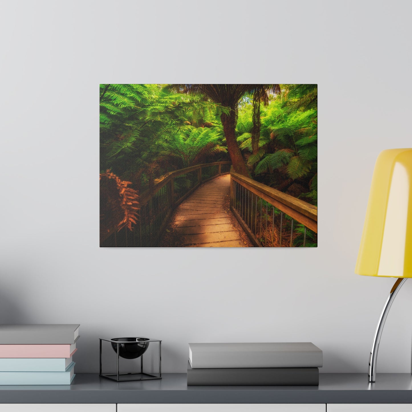 Wooden bridge winding through a lush forest of tall ferns printed on a stretched matte canvas