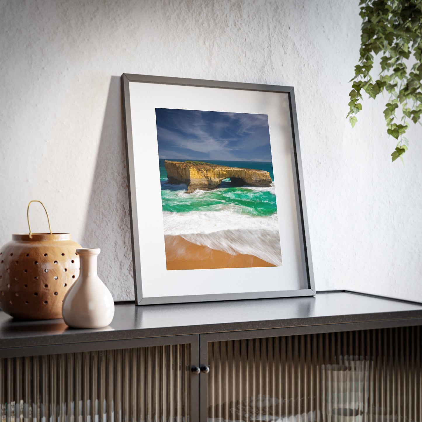 The London Bridge arch with crashing waves printed on a matte framed poster