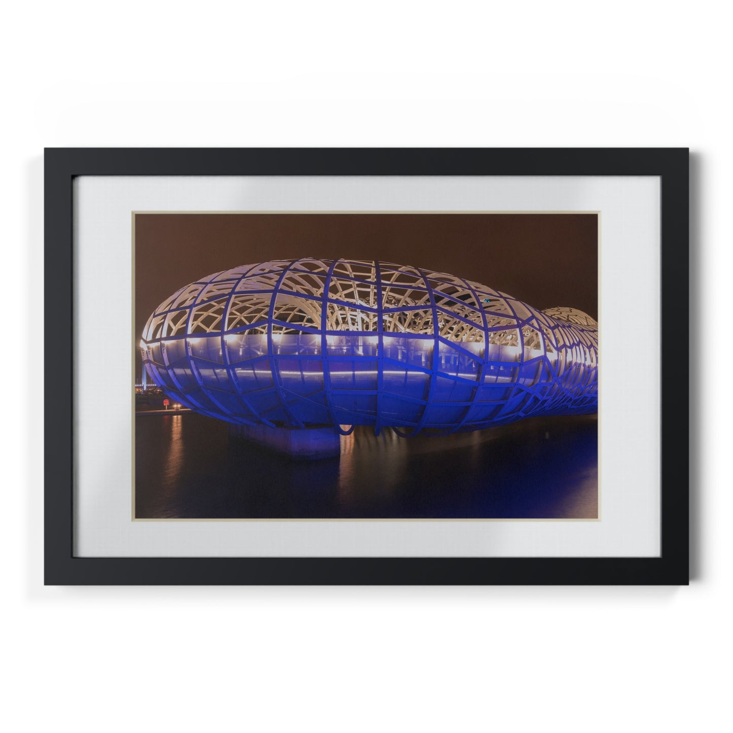 The beautiful Webb Bridge illuminated at night printed on a black framed poster