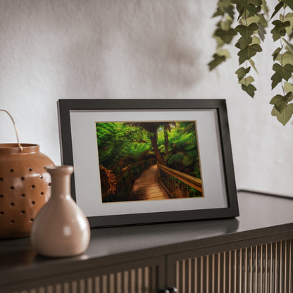 Wooden bridge winding through a lush forest of tall ferns printed black framed poster