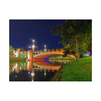 The stunning Victoria Bridge brightly lit at night printed on a stretched matte canvas