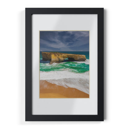 The London Bridge arch with crashing waves printed on a black framed poster