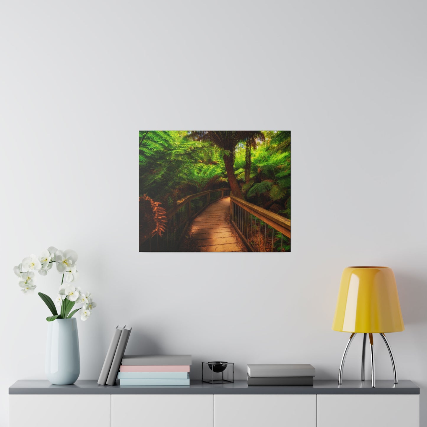 Wooden bridge winding through a lush forest of tall ferns printed on a stretched matte canvas