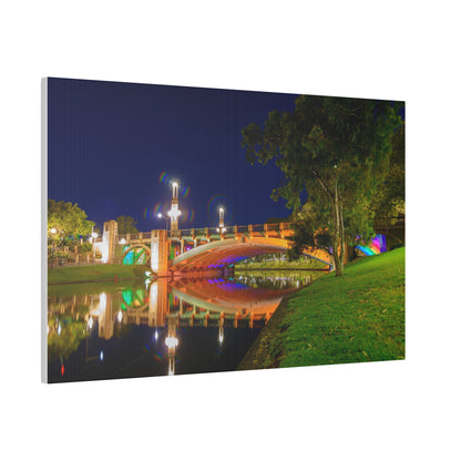 The stunning Victoria Bridge brightly lit at night printed on a stretched matte canvas