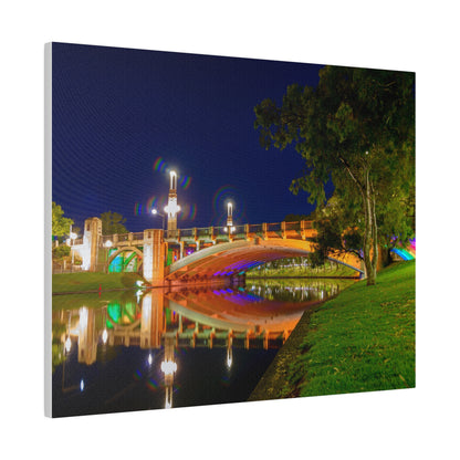 The stunning Victoria Bridge brightly lit at night printed on a stretched matte canvas