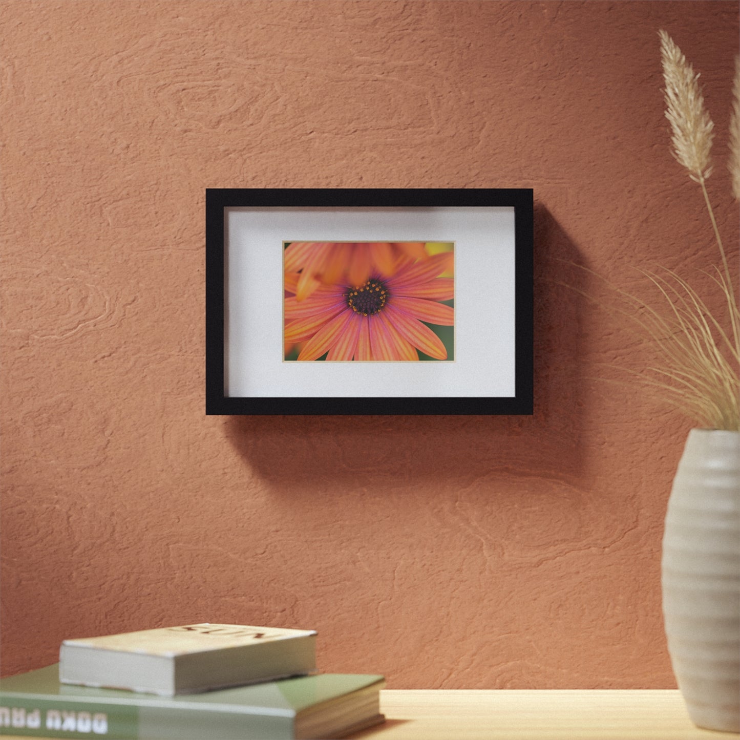 Colorful daisy printed on a black framed posters