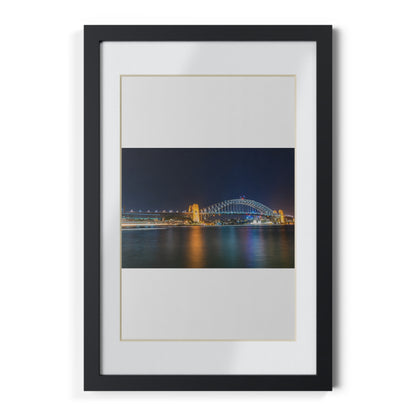 The dazzling Sydney Harbour Bridge at night printed on a black framed poster