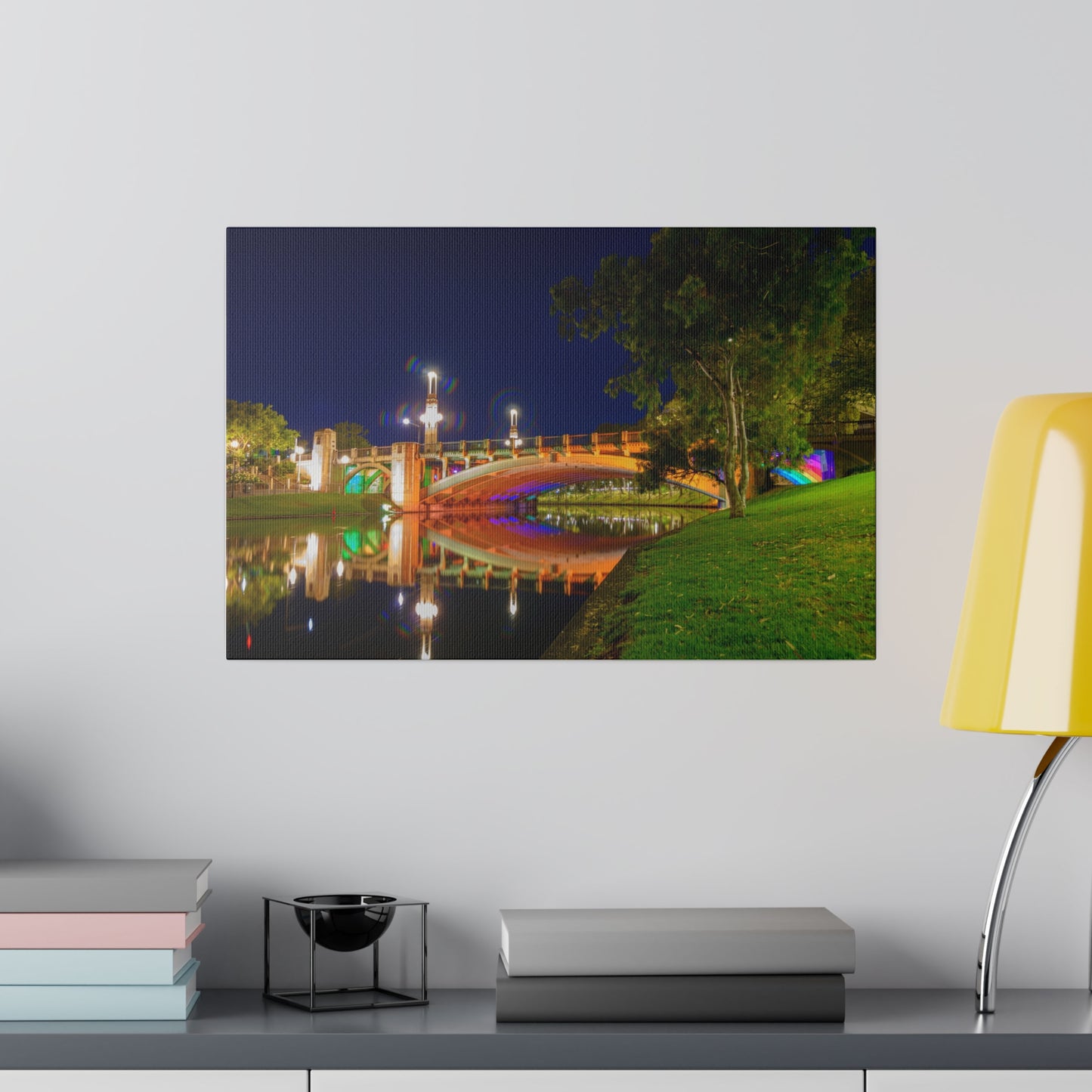 The stunning Victoria Bridge brightly lit at night printed on a stretched matte canvas